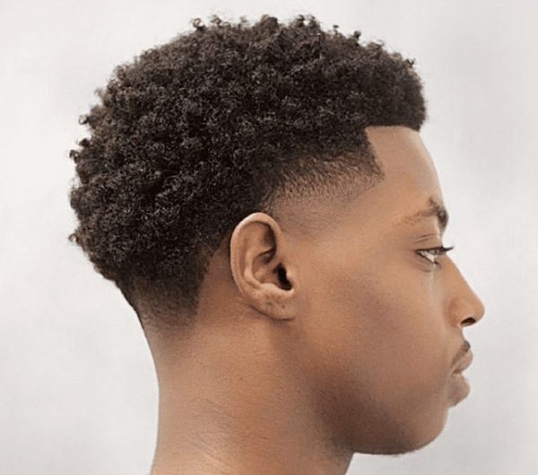 15.Voluminous Mini Curls with High Taper Fade