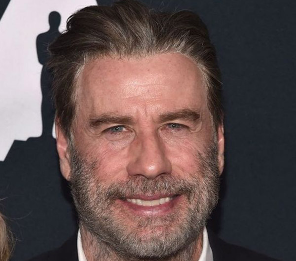 John Travolta is wearing a wig here